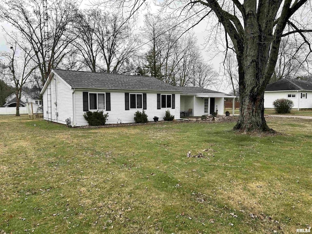 single story home featuring a front yard