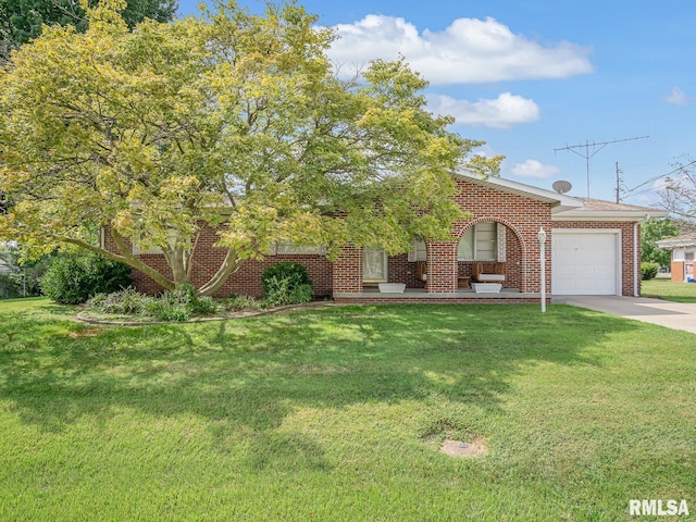 view of front facade with a front yard and a garage