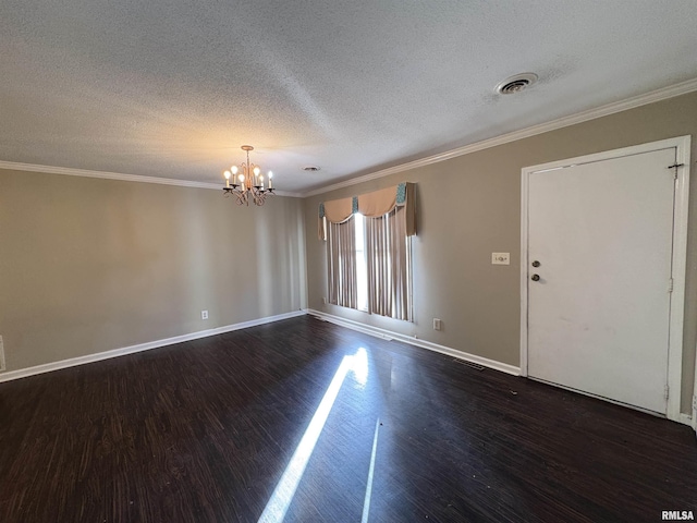 unfurnished room with crown molding, dark hardwood / wood-style flooring, and an inviting chandelier