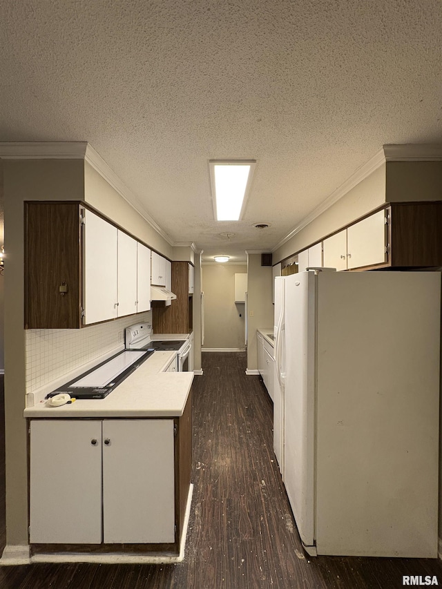 kitchen with white cabinets, a textured ceiling, white appliances, and tasteful backsplash