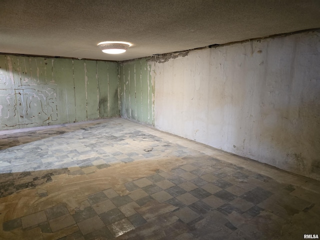 empty room featuring a textured ceiling