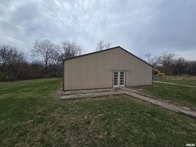 exterior space with a yard and french doors