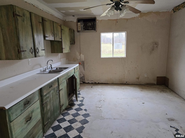 kitchen featuring ceiling fan, sink, and green cabinetry