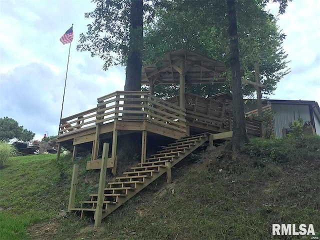 back of house with a wooden deck