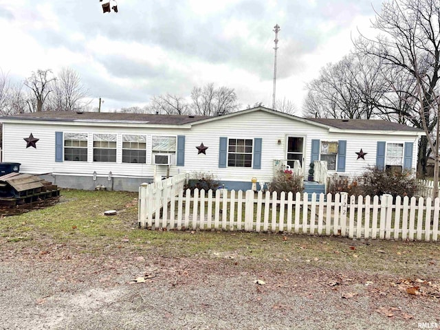 manufactured / mobile home with a fenced front yard