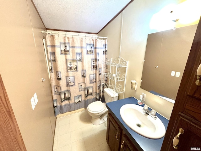 bathroom featuring a textured ceiling, vanity, and toilet