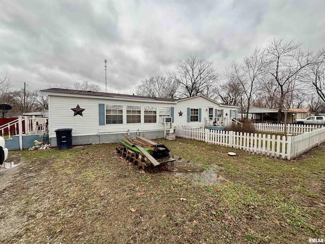 back of house with cooling unit and fence