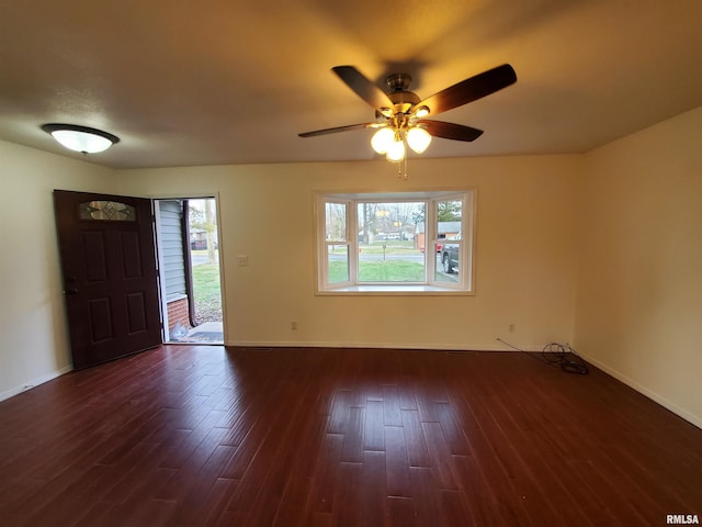 interior space with dark hardwood / wood-style floors and ceiling fan