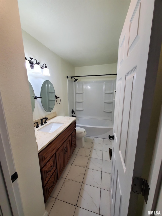 full bathroom featuring tile patterned floors, vanity, bathtub / shower combination, and toilet