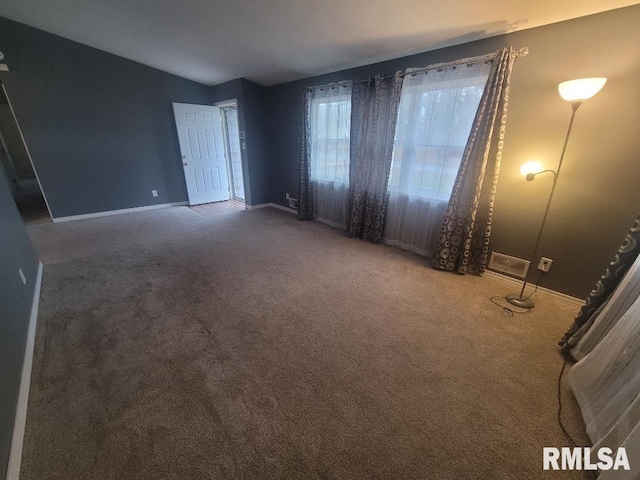 empty room with carpet flooring