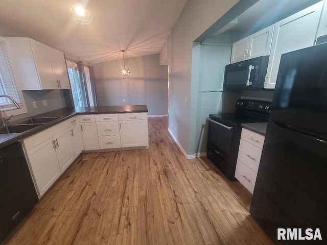 kitchen with black appliances, sink, light hardwood / wood-style flooring, white cabinetry, and kitchen peninsula