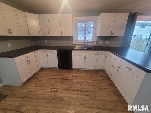 kitchen with white cabinetry, sink, dishwasher, and light hardwood / wood-style floors