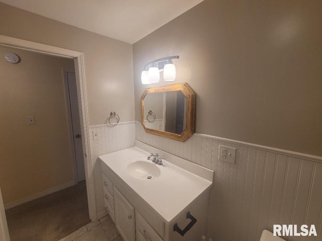 bathroom with tile patterned floors and vanity