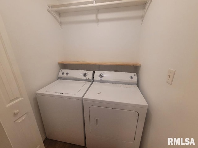 washroom with washing machine and clothes dryer