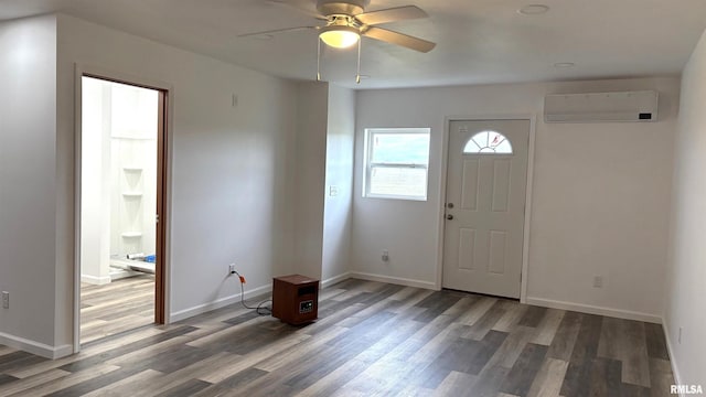 foyer with hardwood / wood-style flooring, a wall mounted AC, and ceiling fan