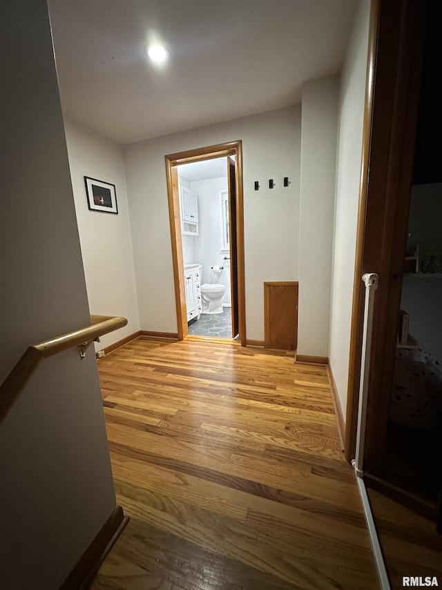 hallway featuring wood-type flooring