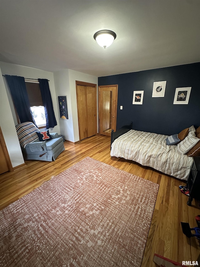 bedroom with light hardwood / wood-style flooring