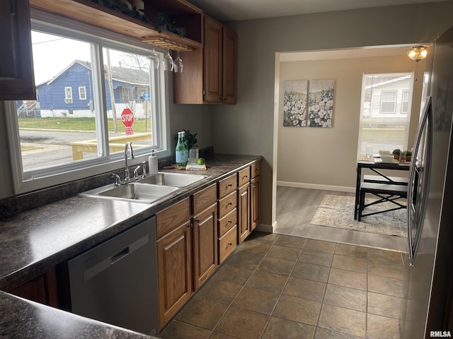 kitchen with sink and appliances with stainless steel finishes