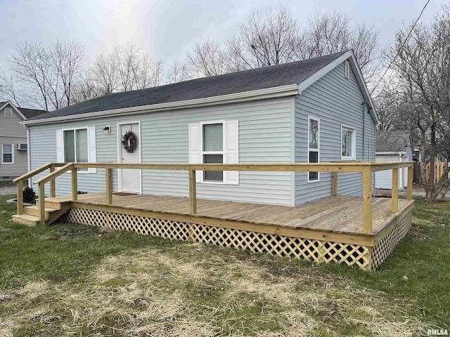 back of property with a deck