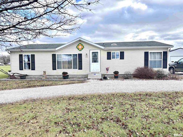 ranch-style house with a front yard