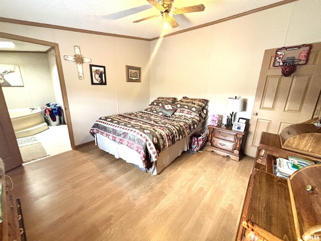 bedroom with ceiling fan, ornamental molding, and light wood finished floors