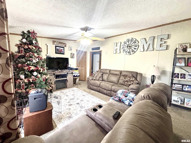 living room featuring ceiling fan, crown molding, carpet flooring, and a textured ceiling