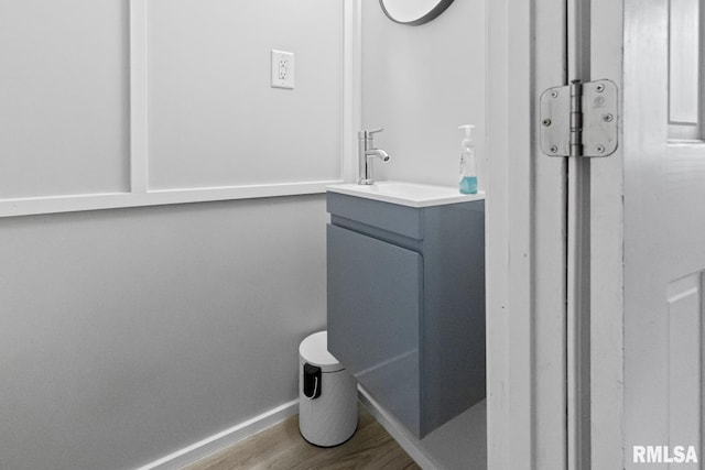 bathroom with vanity and hardwood / wood-style flooring