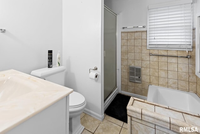 full bathroom featuring vanity, heating unit, separate shower and tub, tile patterned flooring, and toilet