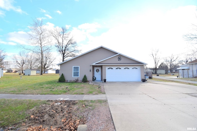 view of front facade with a garage, a shed, and a front yard