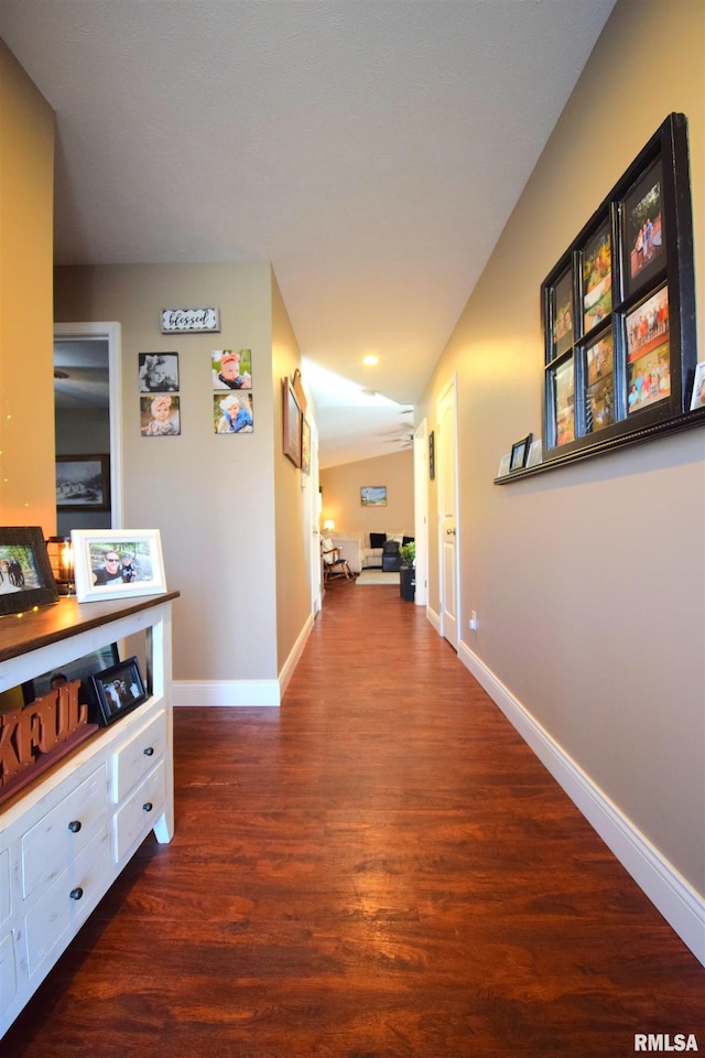 hallway with dark hardwood / wood-style flooring