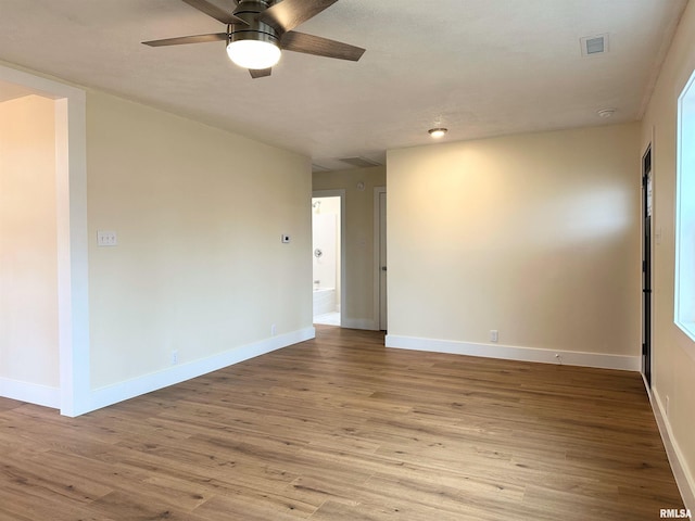 unfurnished room featuring ceiling fan and light hardwood / wood-style floors