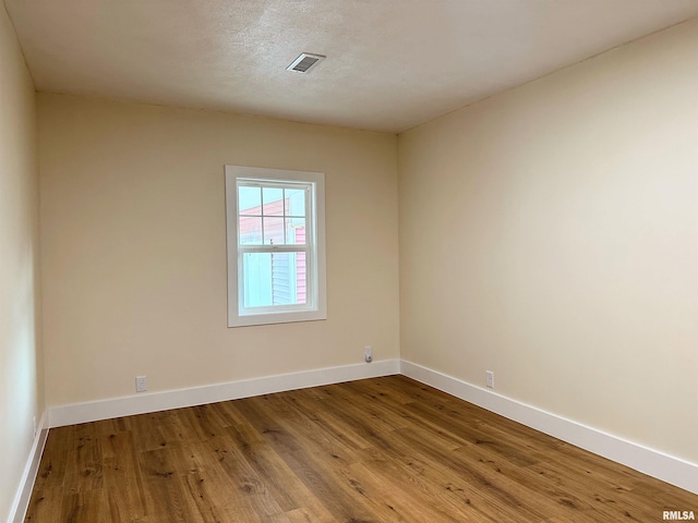 unfurnished room with light hardwood / wood-style floors