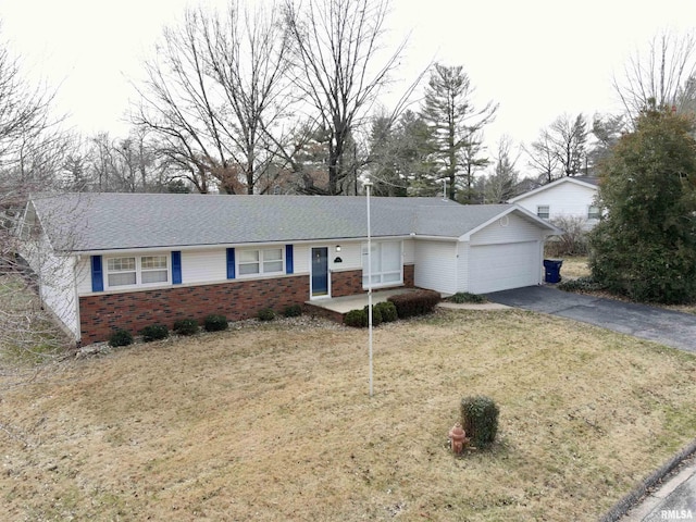 single story home featuring a front yard and a garage