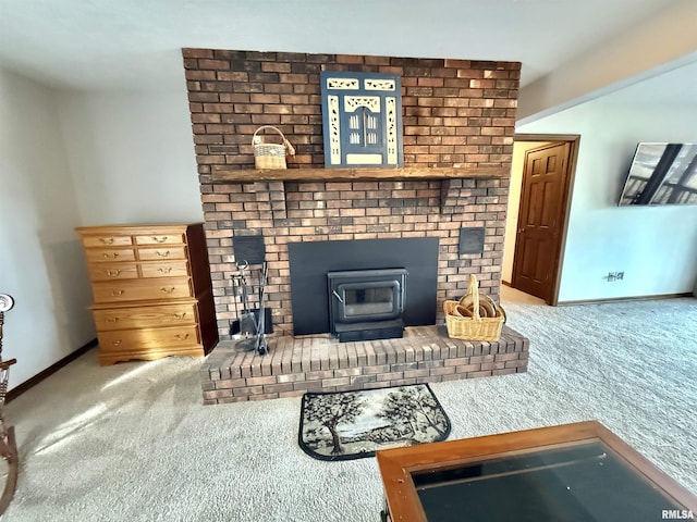 living room featuring a wood stove and carpet