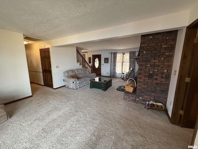 unfurnished living room with carpet flooring and a textured ceiling