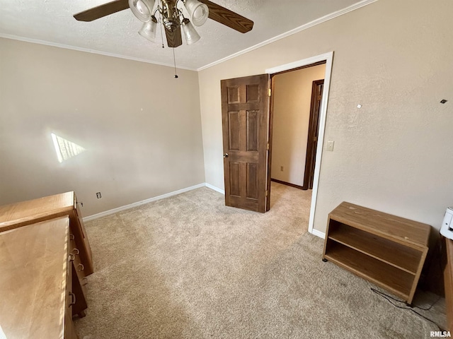 unfurnished bedroom featuring light carpet, a textured ceiling, ceiling fan, and ornamental molding