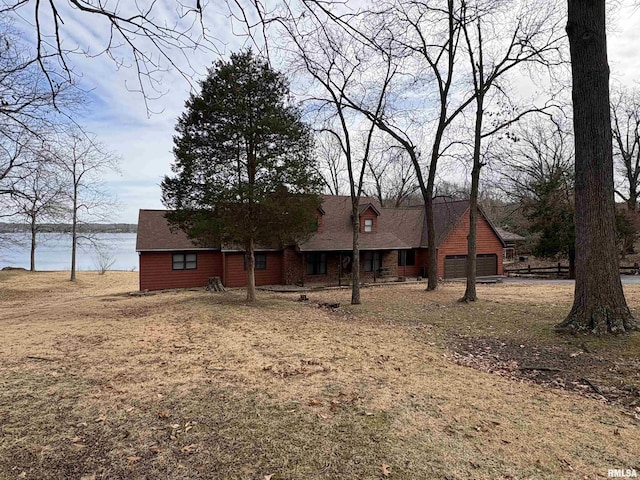 view of front of home with a water view