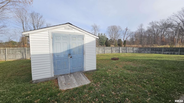 view of outbuilding featuring a lawn