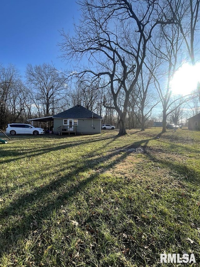 view of yard with a carport