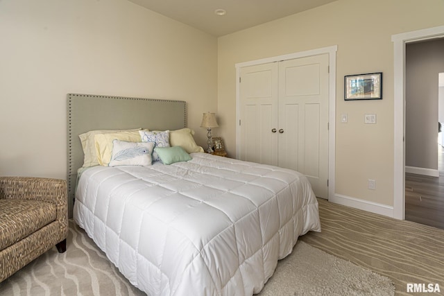 carpeted bedroom featuring a closet