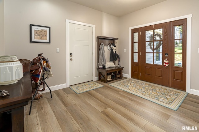 entryway with light hardwood / wood-style flooring