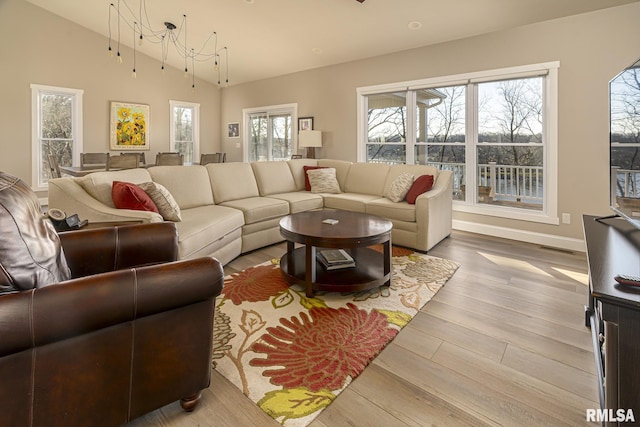 living room with hardwood / wood-style flooring and lofted ceiling