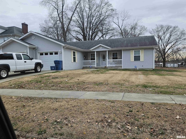 ranch-style house with a porch, a garage, and a front yard