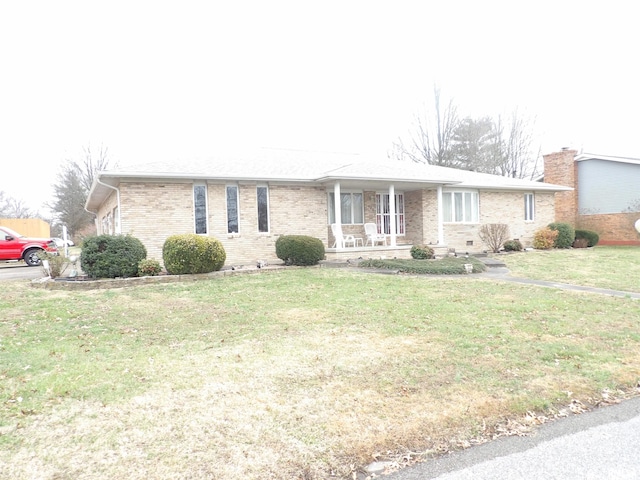 ranch-style house with a porch and a front lawn