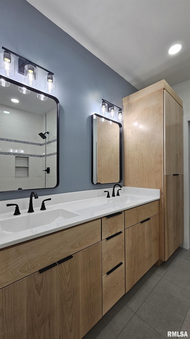809 N 27th St, Herrin, IL 62948 - bathroom featuring double vanity, tiled shower, and a sink