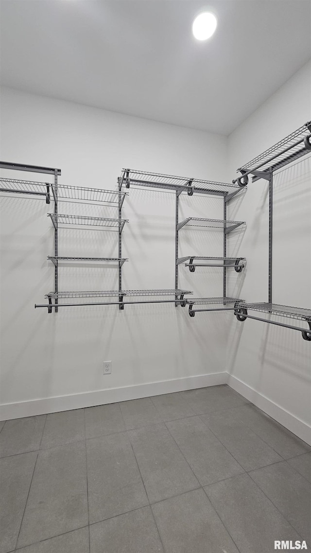 809 N 27th St, Herrin, IL 62948 - spacious closet featuring dark tile patterned flooring