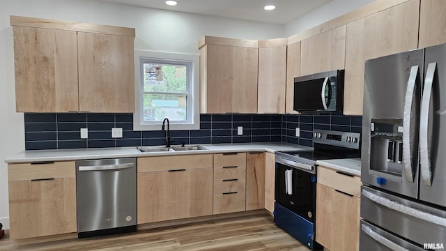 809 N 27th St, Herrin, IL 62948 - kitchen featuring stainless steel appliances, light brown cabinets, light countertops, and a sink
