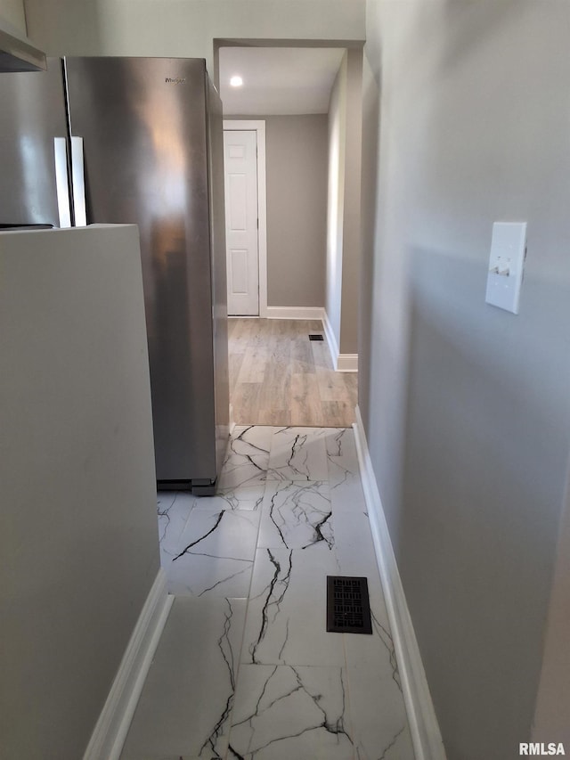309 W 11th St, Metropolis, IL 62960 - hall with marble finish floor, baseboards, and visible vents