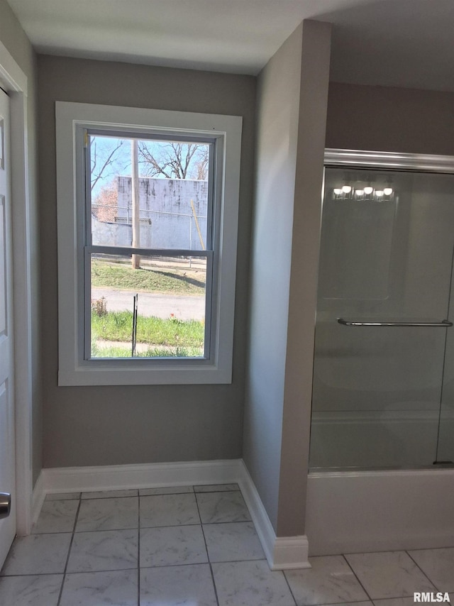 309 W 11th St, Metropolis, IL 62960 - full bath featuring marble finish floor, baseboards, bathtub / shower combination, and a healthy amount of sunlight
