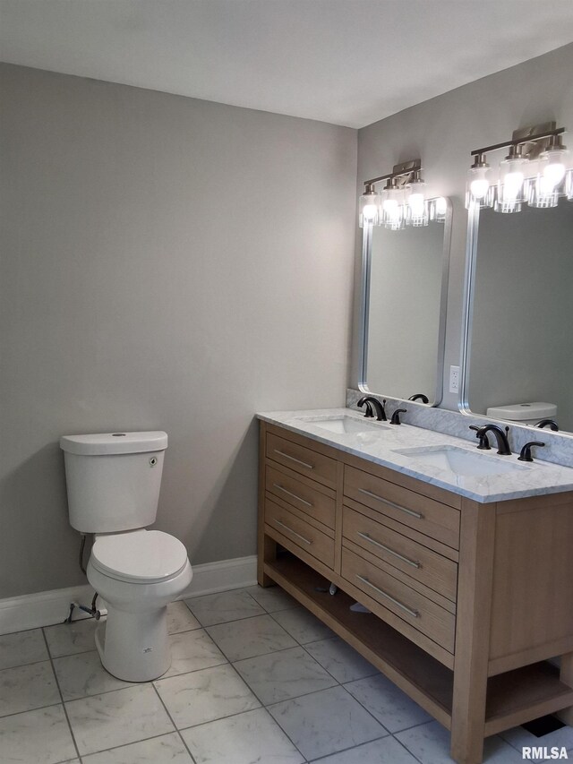 309 W 11th St, Metropolis, IL 62960 - bathroom featuring marble finish floor, a sink, and toilet
